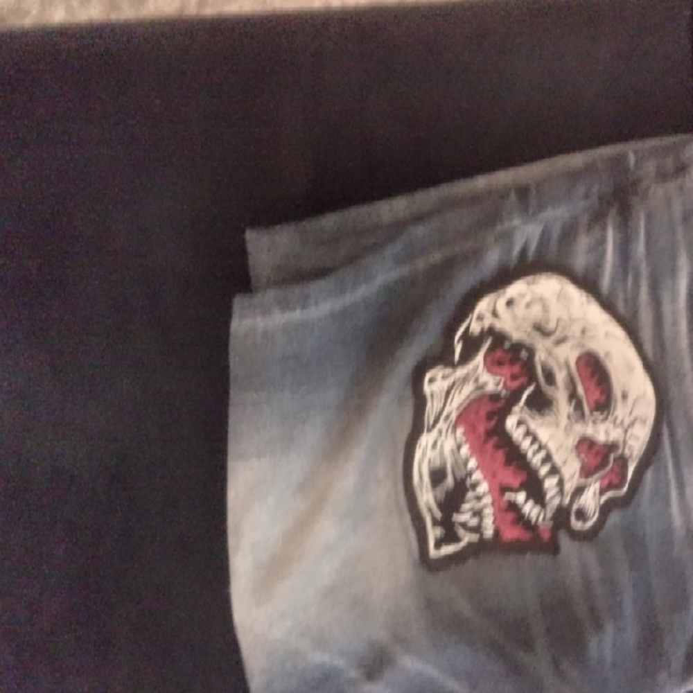 Stylish Men's Denim with Skull Accent